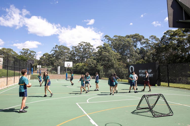 students using the basketball court at Sylvania High School